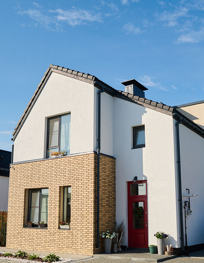 facade-of-small-white-cottage-with-three-windows-a-DYPUD6V