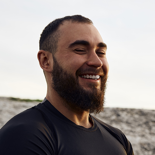 young-bearded-man-portrait-outdoors-in-the-mountai-6Z46ZMB